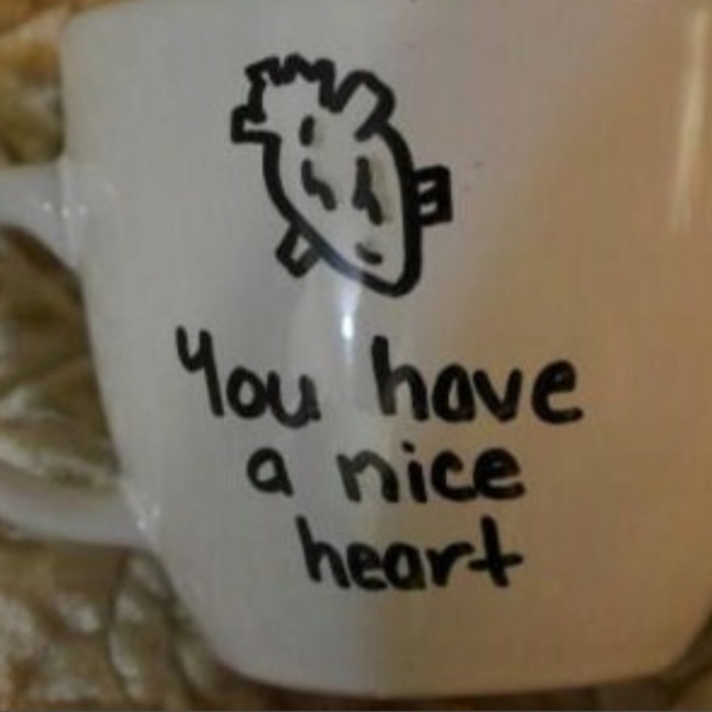 Charming White Mug with Heart Design